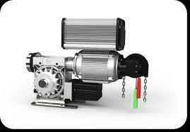 A close up of a motor with chains attached to it on a white background.
