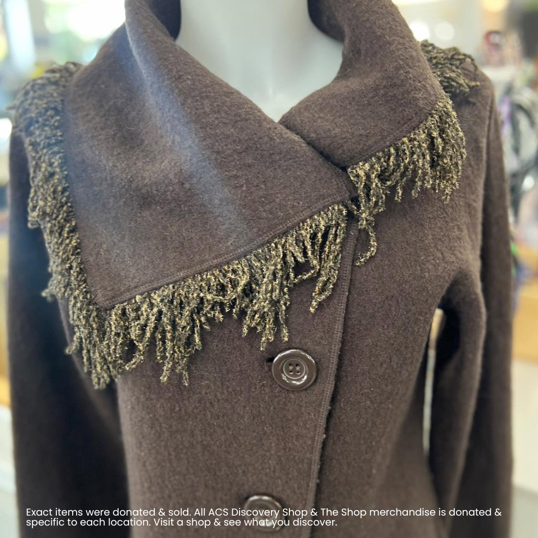 Brown wool coat with large collar and fringed trim, shown close up