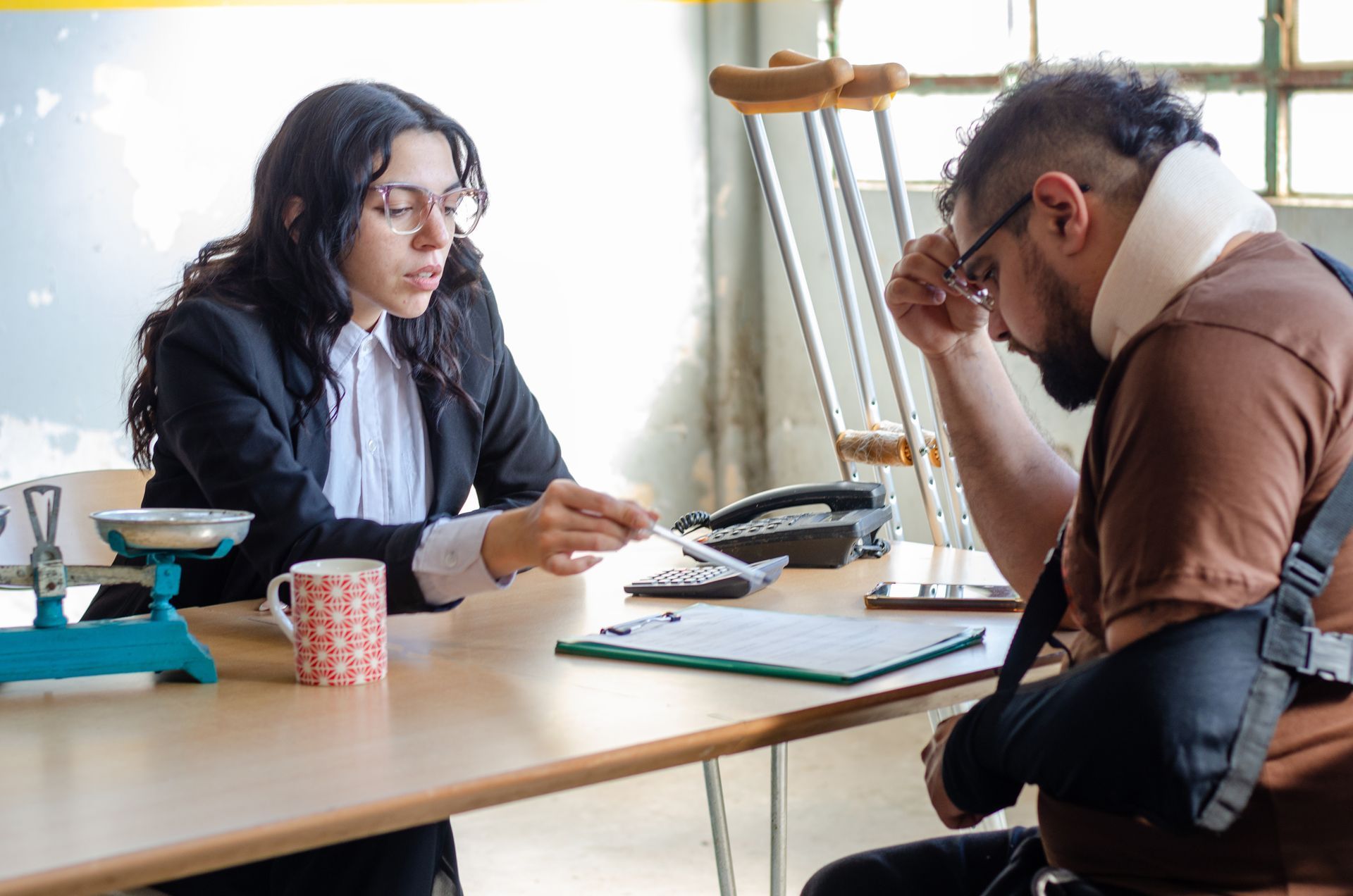 A lawyer assists an injured man with a legal problem.