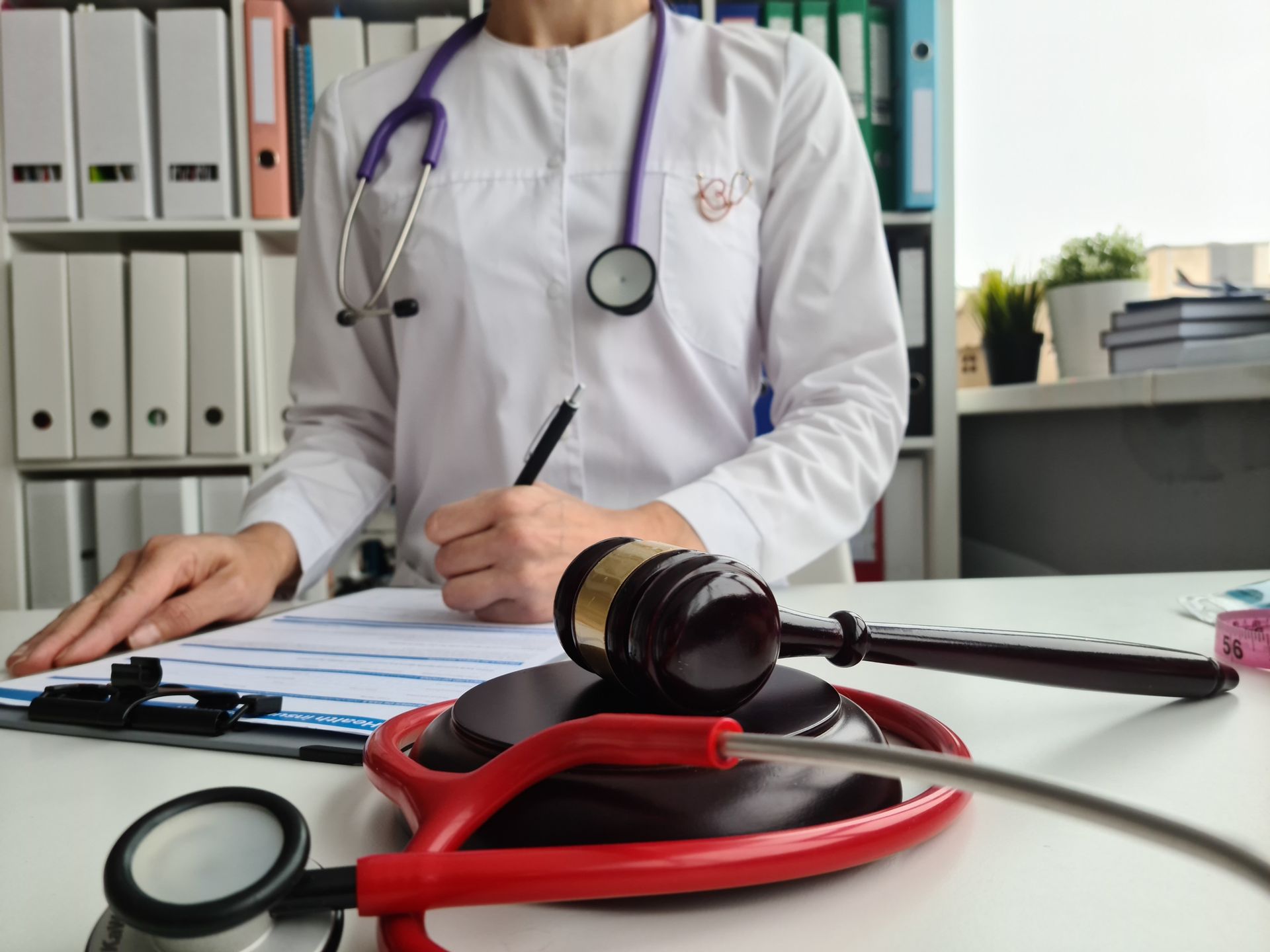 Judge gavel and court doctor stethoscope and doctor writes. Judge gavel and court doctor stethoscope and doctor writes.