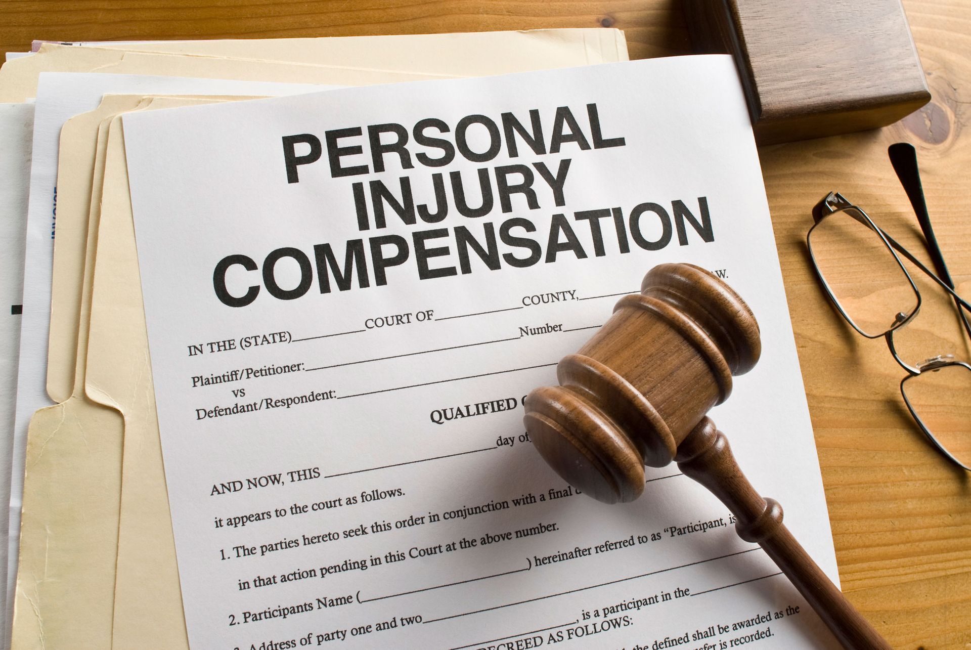 Personal injury compensation form with a hammer Personal injury compensation form with a hammer