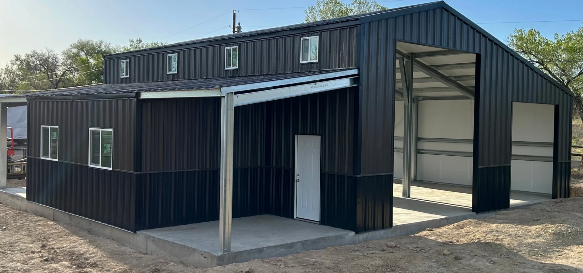An empty warehouse with a roller shutter door and a concrete floor.