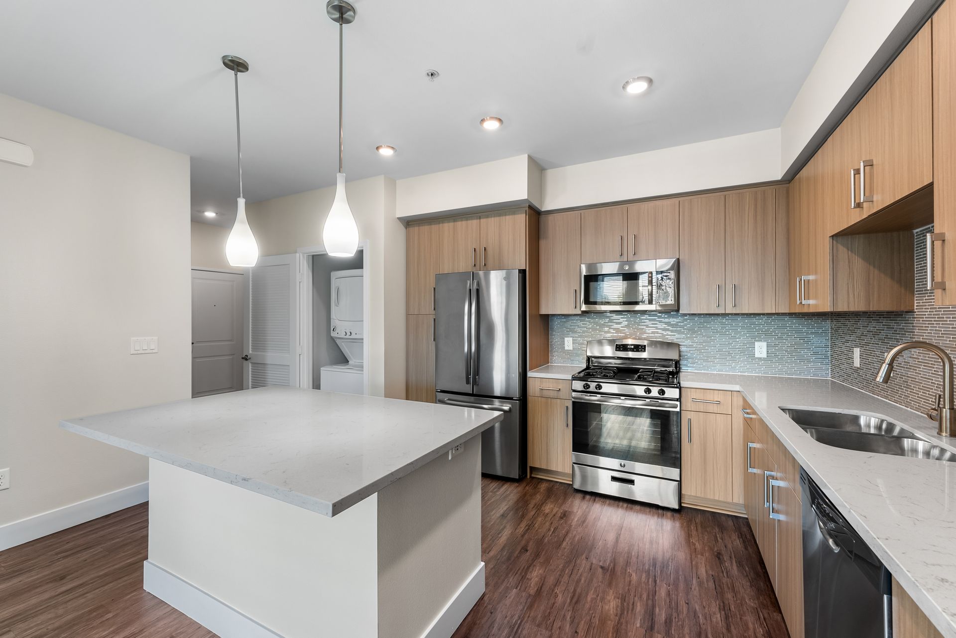 Kitchen with island and overhead lighting