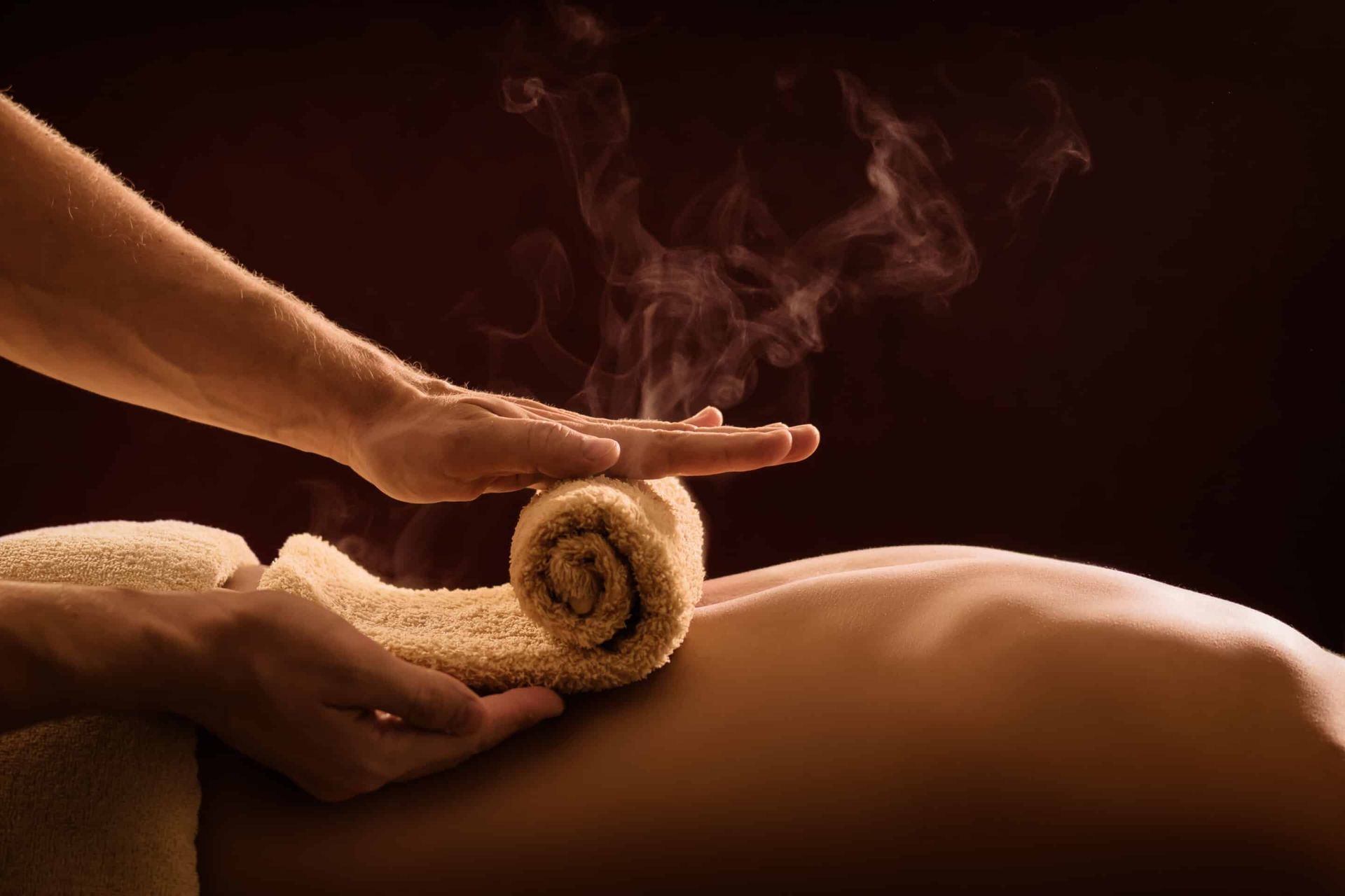 A,Professional,Therapist,Applies,A,Hot,Towel,On,The,Back Belmont Shore Spa Therapeutic massage logo