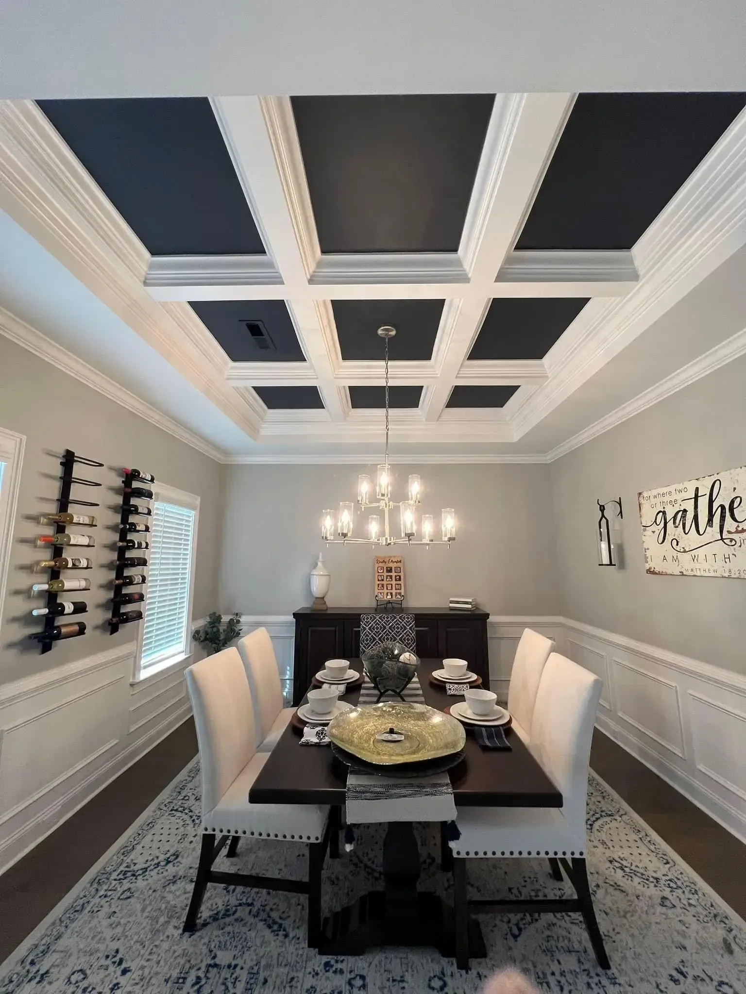Dining room in Parkside, Meridianville with navy coffered ceiling panels, white beams and white wainscoting