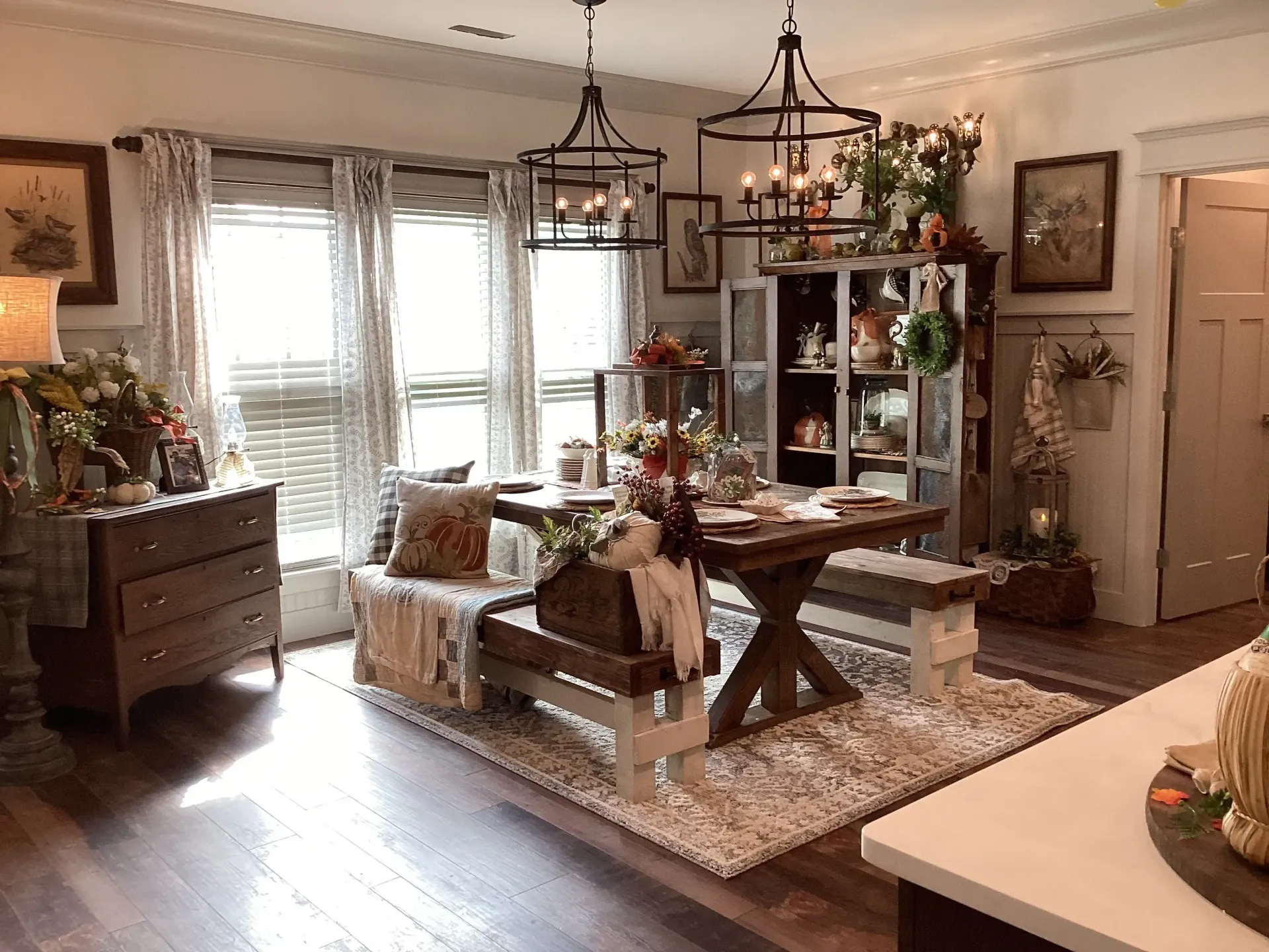 Farmhouse dining nook in Parkside, Meridianville with white walls, board and batten wainscoting and white trim