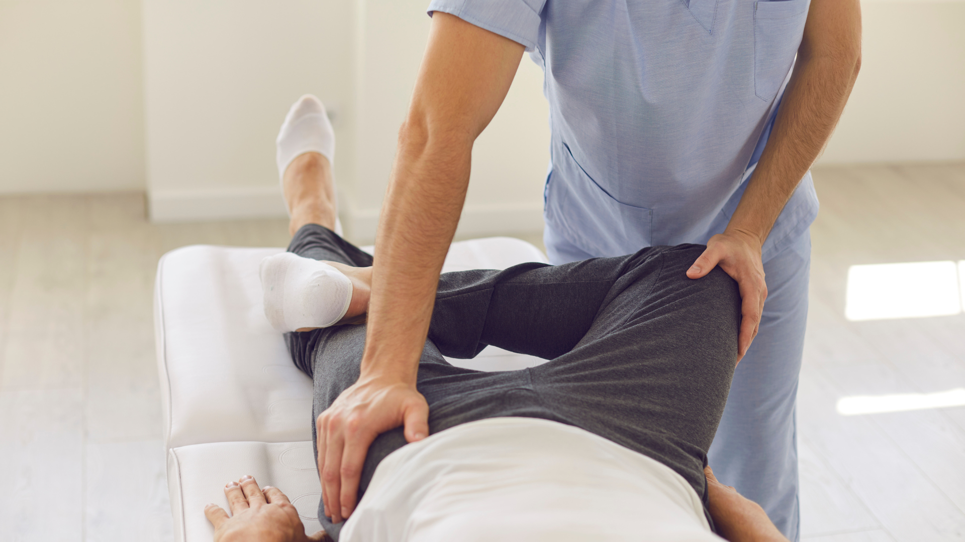 a woman is holding her back in pain .