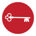 White key symbol on a red circle background.