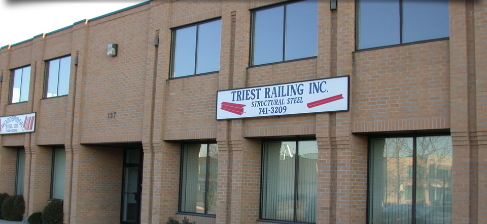 A brick building with a sign that says trust railing inc