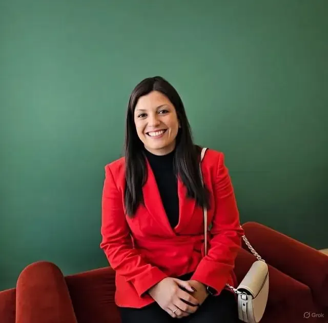 Smiling woman from the family assessment centre team in a red blazer