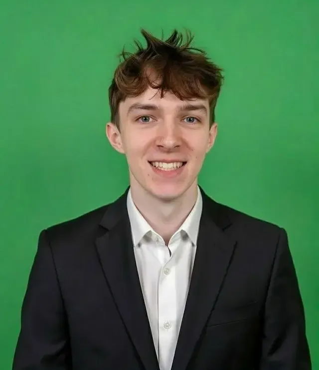 Friendly young family assessment centre team member in a black suit with white shirt