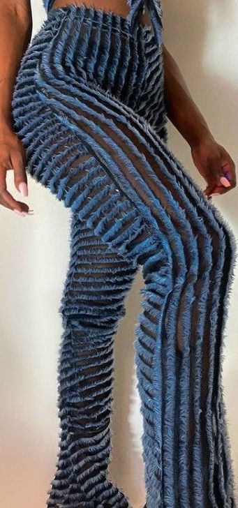 A woman is wearing a pair of blue striped pants.