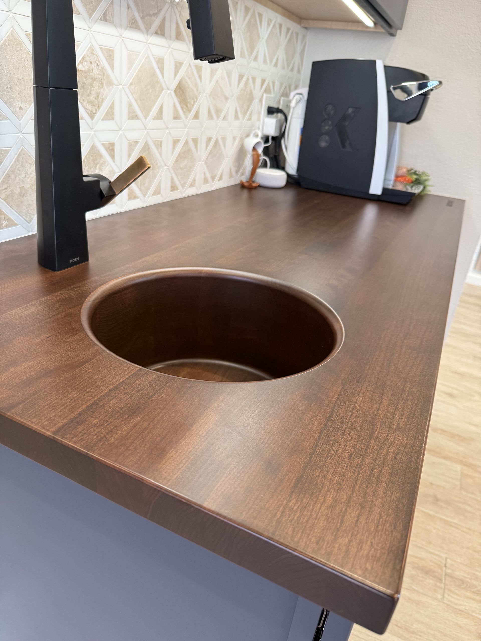 Seamless integrated wood sink in Grothouse solid wood countertop. Touchless faucet.