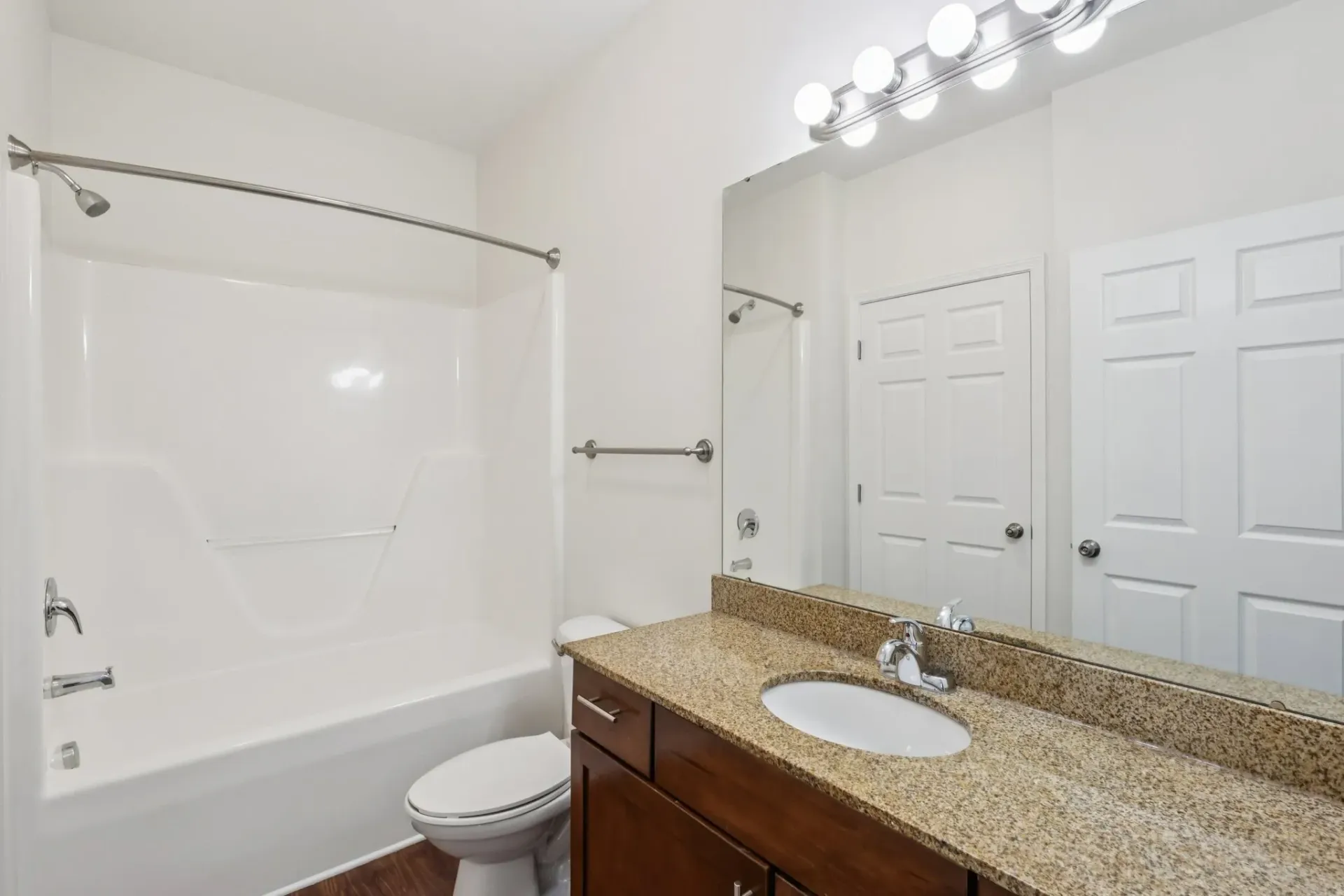 Bathroom with a vanity, toilet, and bathtub/shower combo at Catherine 36 Apartments for rent in Charlotte, NC