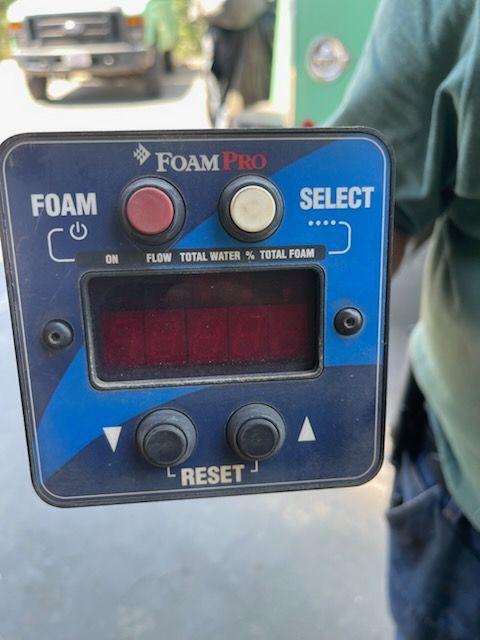 Foam Pro control panel with digital display, foam/select buttons, and reset switch on a vehicle.