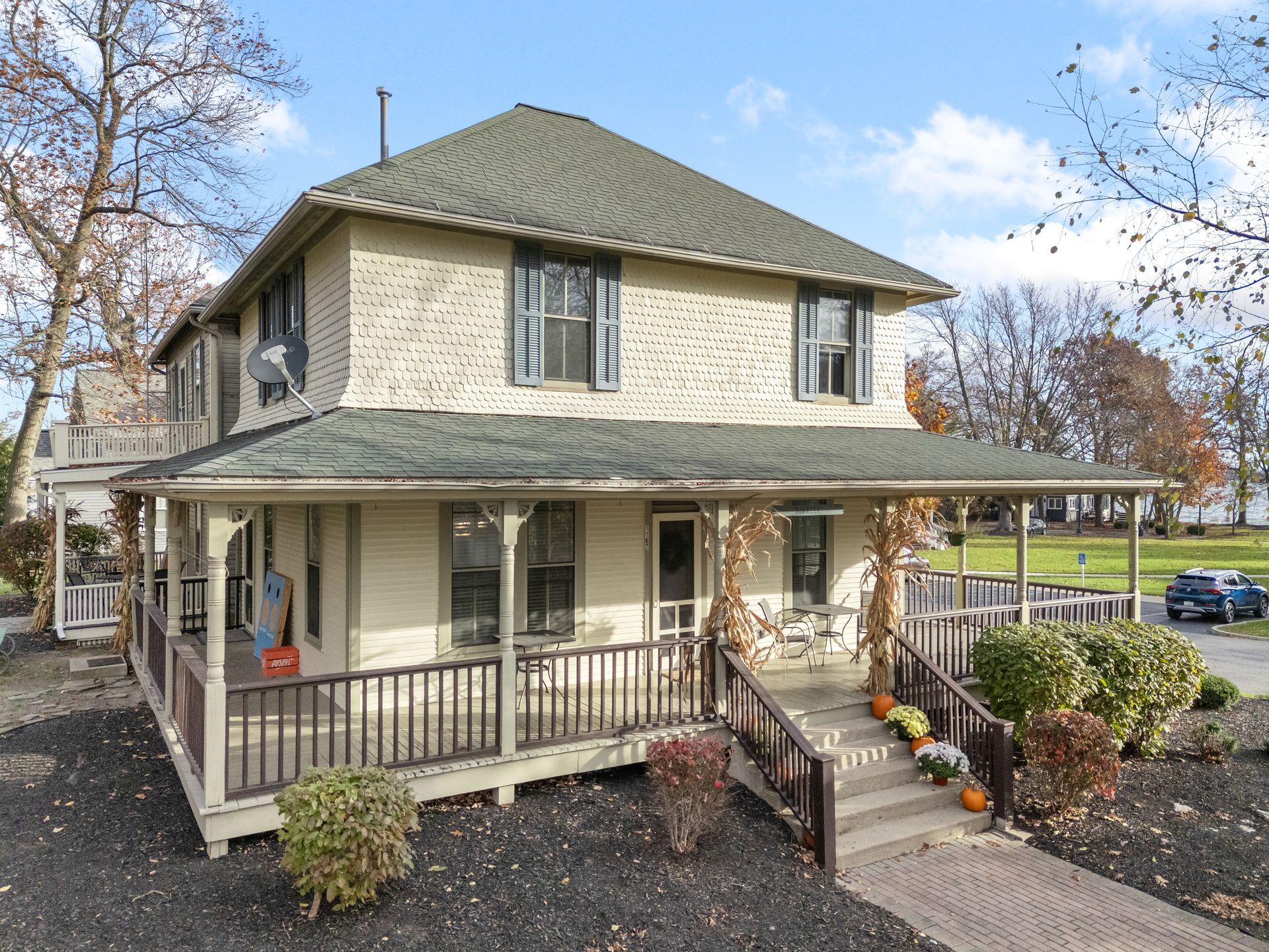 A large house with a large porch and stairs