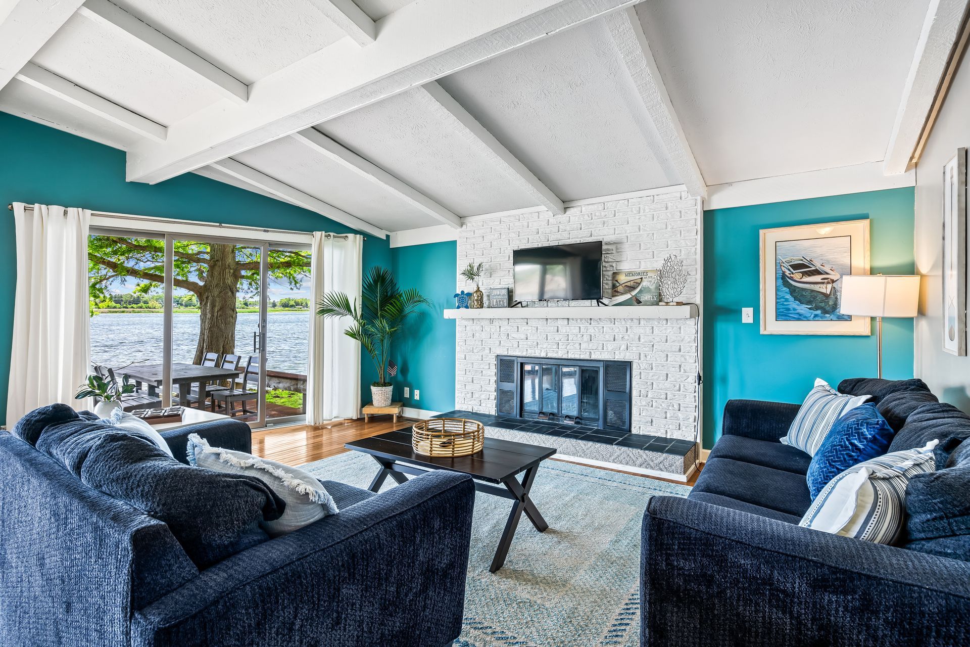 A living room filled with furniture and a fireplace.
