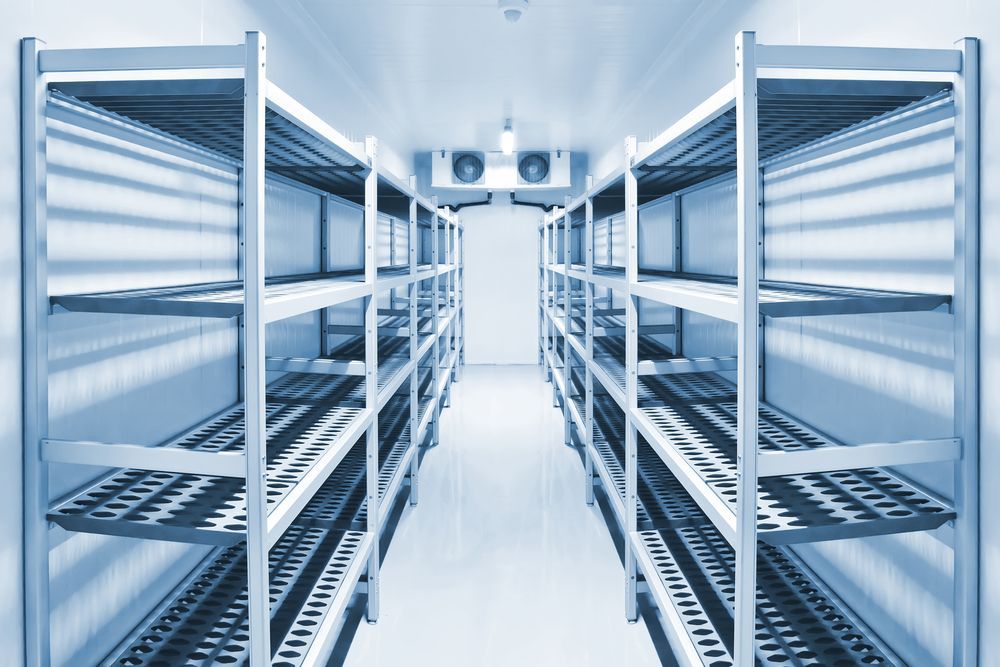 Empty Industrial Freezer, Metal Shelving, White Walls, Cooling Units — SealTite in Ballina, NSW