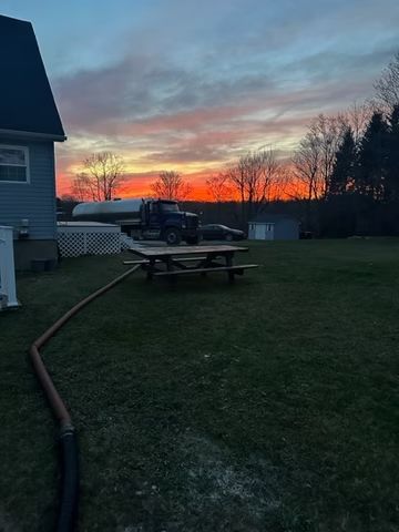 Truck in a backyard at sunset