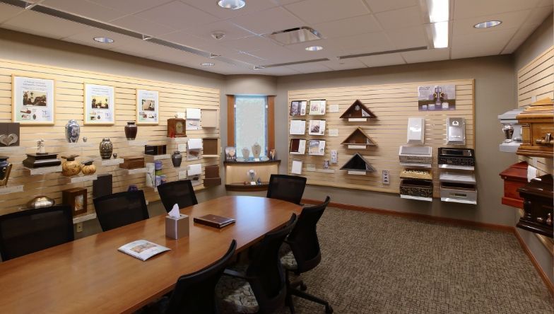 a conference room with a table and chairs in it .