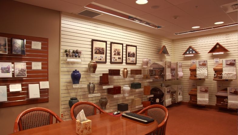 a room with a lot of shelves and pictures on the wall .