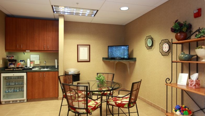a waiting room with a sign that says newcomer
