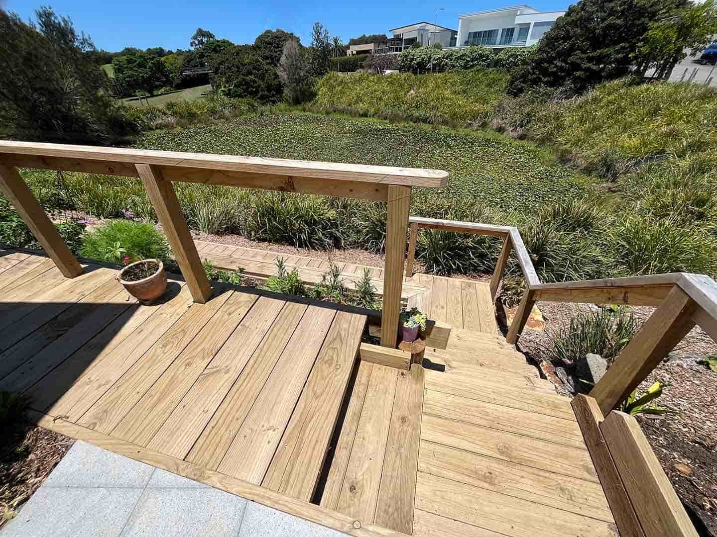 A Wooden Deck With Stairs Leading Up To It — Gnomes Landscape & Garden Supplies In Old Bar, NSW