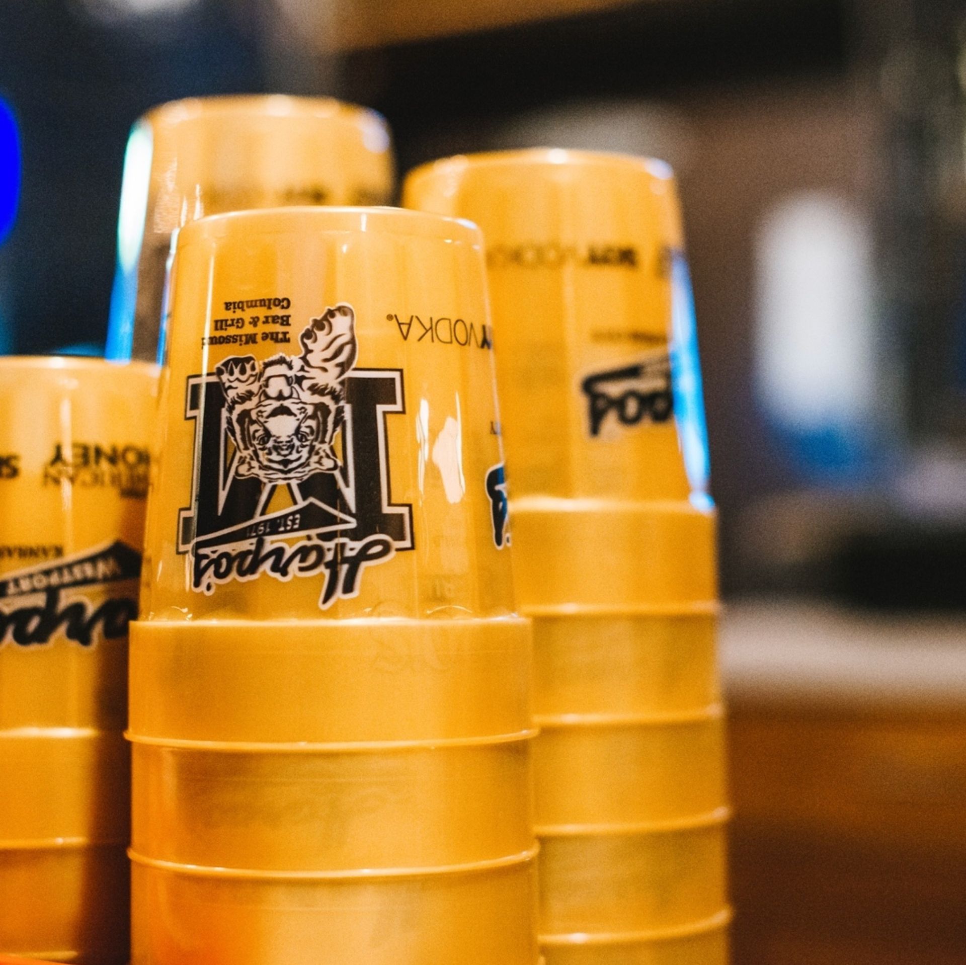 Stacked yellow plastic cups with the