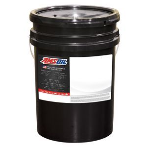 Multi-viscosity all-weather hydraulic fluid pouring into a backhoe loader reservoir for consistent year-round hydraulic performance