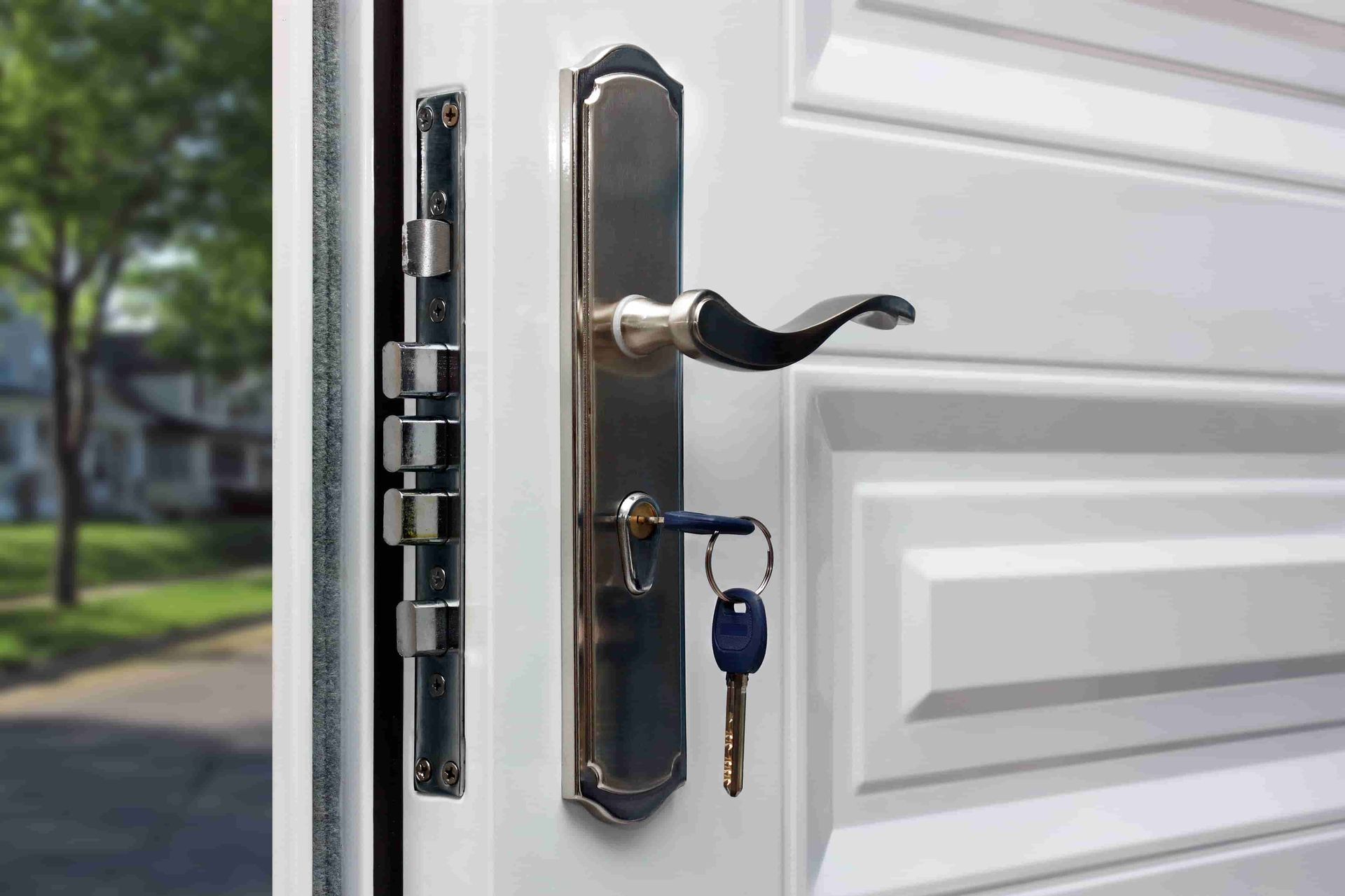 A Close up Of a Door with A Key in The Lock — ADC Locksmiths in Wollongong, NSW