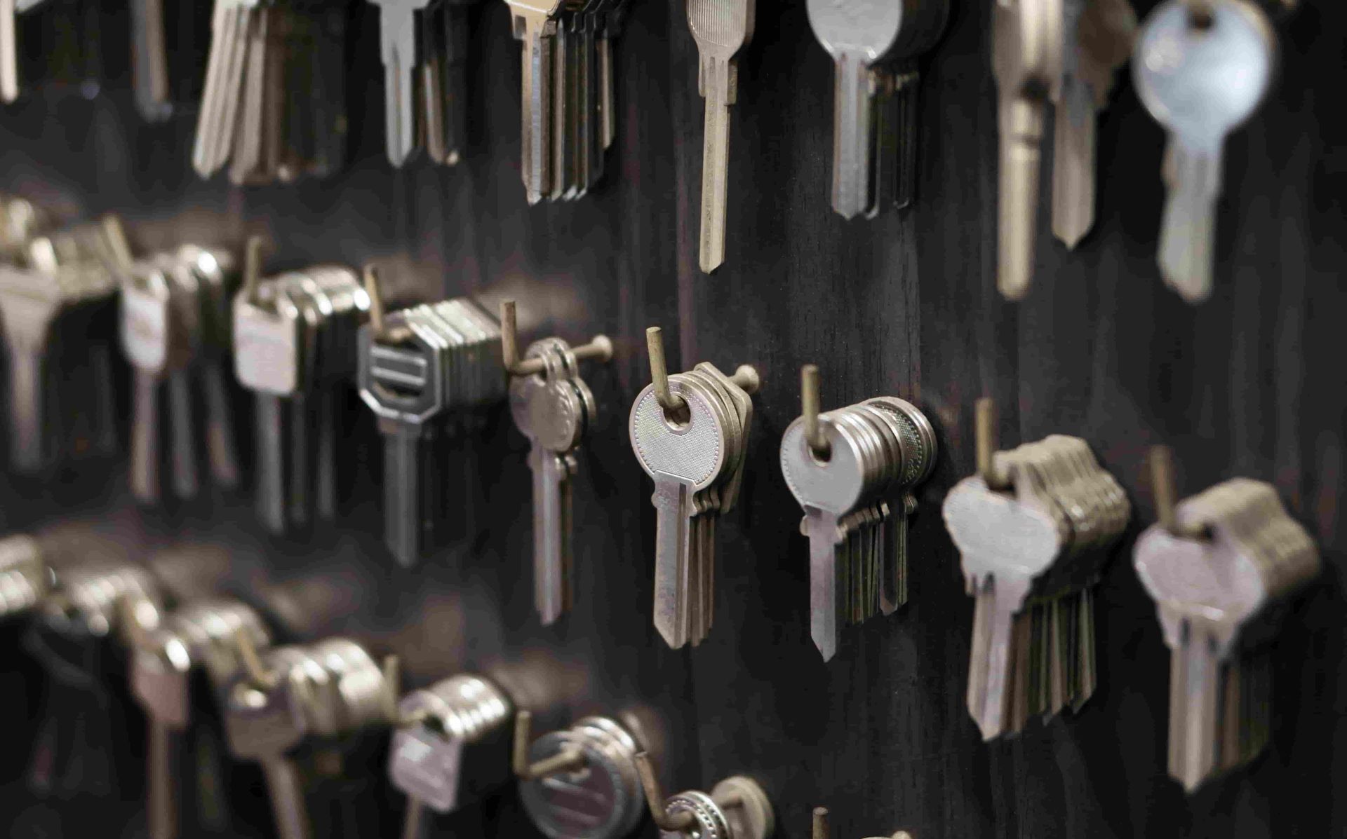 A Bunch of Keys Are Hanging on a Wall — ADC Locksmiths in Wollongong, NSW