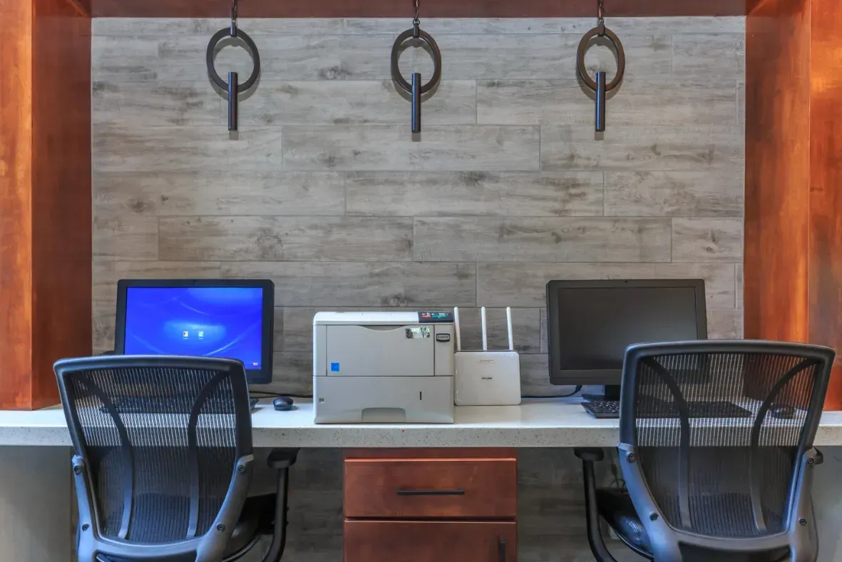 Business center with computers, printer, and WiFi router