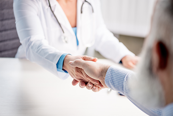 Doctor Shaking Hands With Patient — Gulf Shores, AL — Jeanne Birkenhauer, MD, PC Doctor Shaking Hands With Patient — Gulf Shores, AL — Jeanne Birkenhauer, MD, PC
