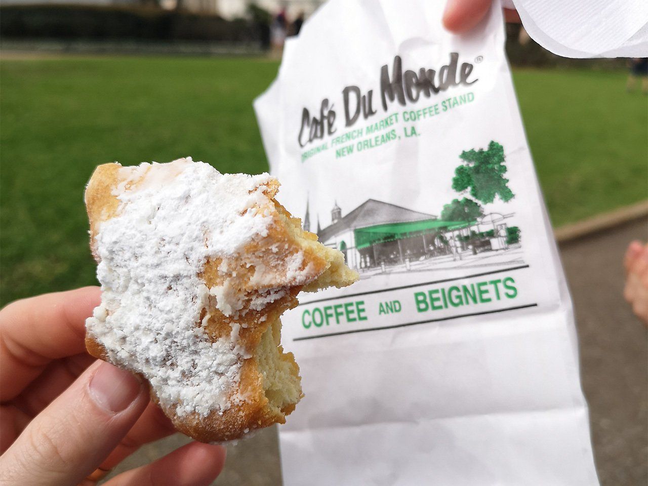 A beignet being enjoyed in New Orleans, USA
