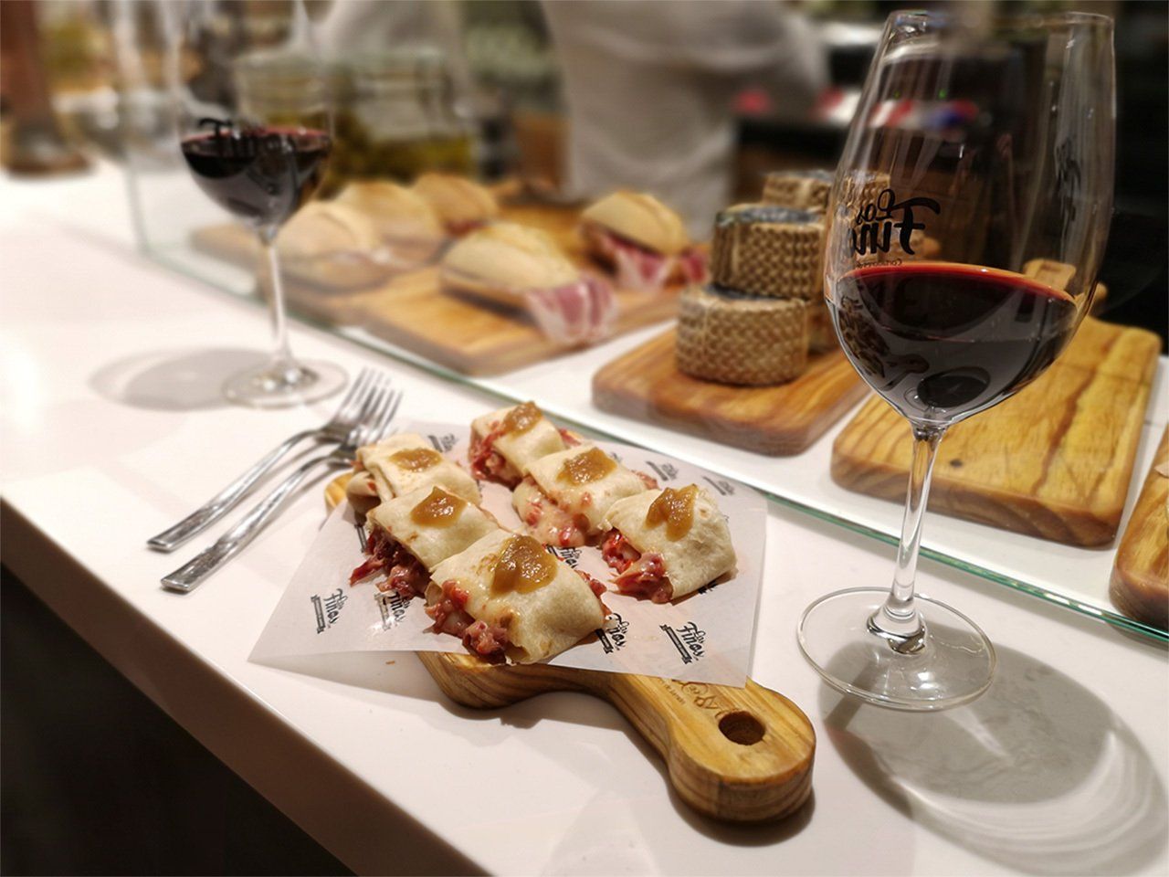 A tapa and a glass of wine served on a bar in Burgos, Spain