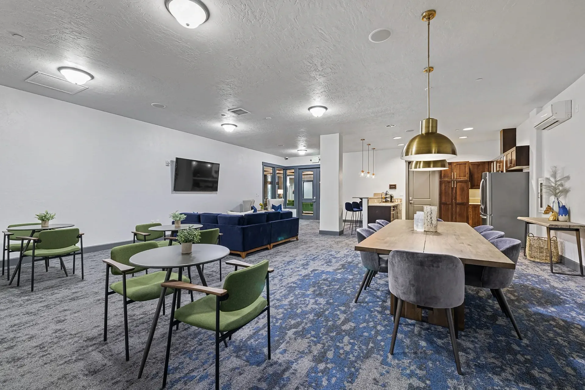 Community lounge area with seating and a dining table.