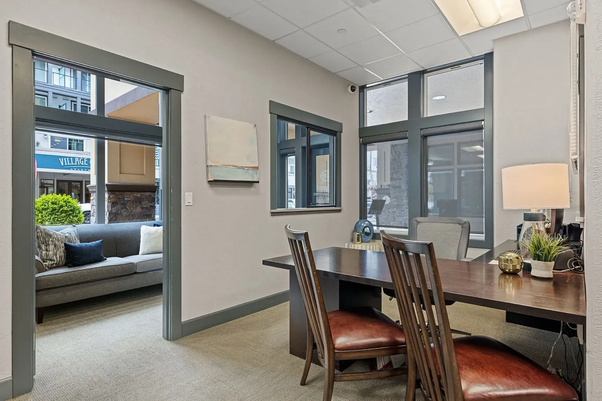 Office reception desk and waiting area with couch