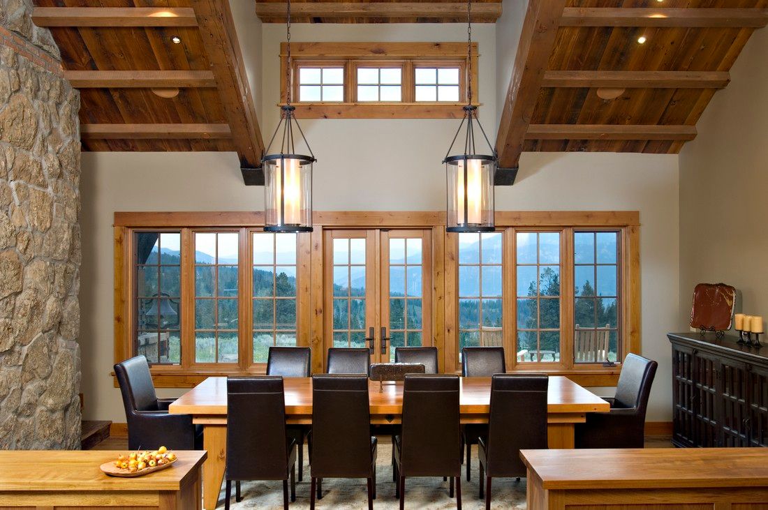 A large dining room with a long table and chairs