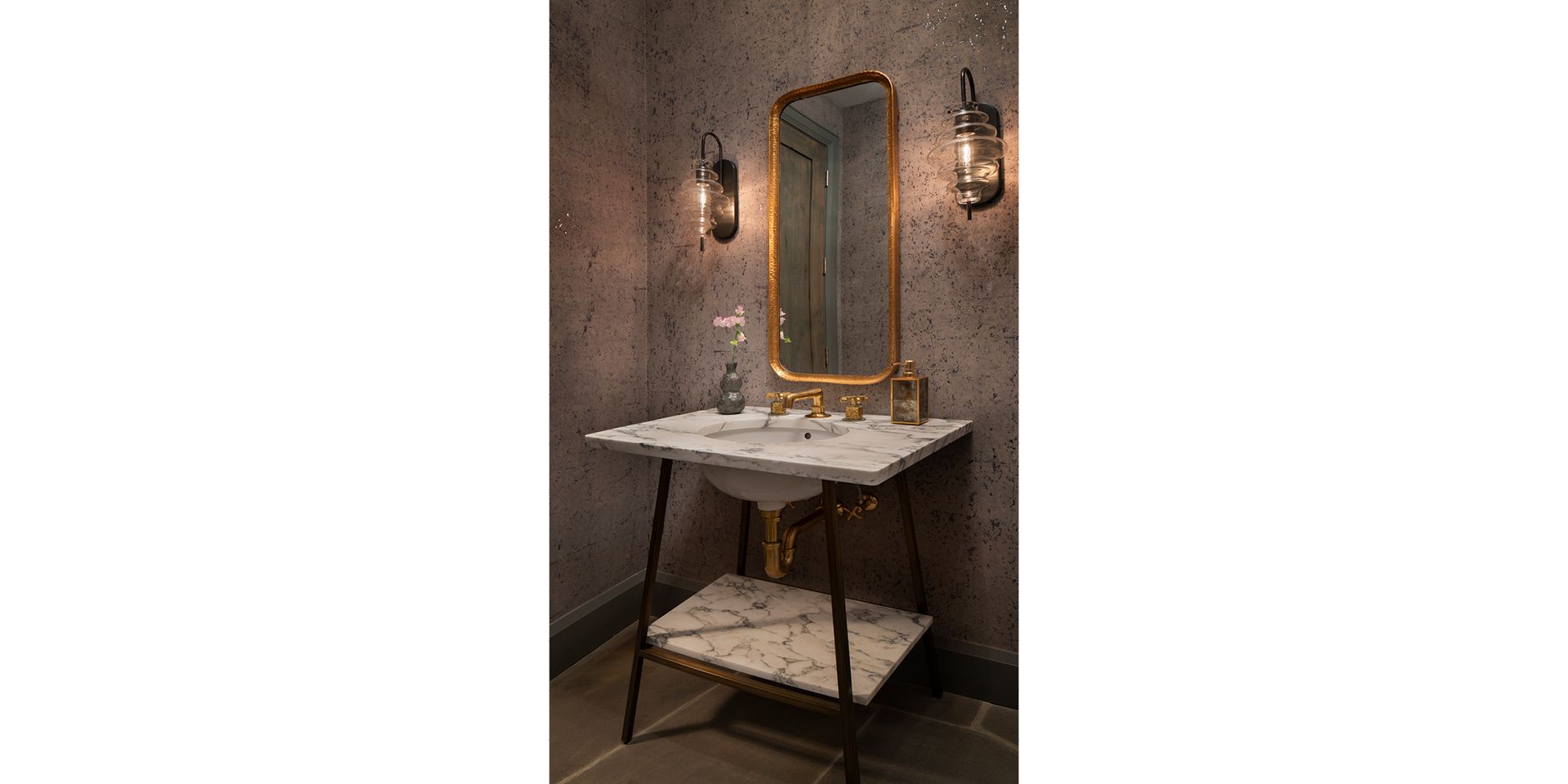 A bathroom with a sink , mirror , and shelf.