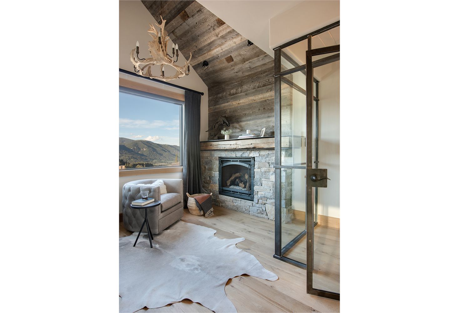 A living room with a fireplace and a window.