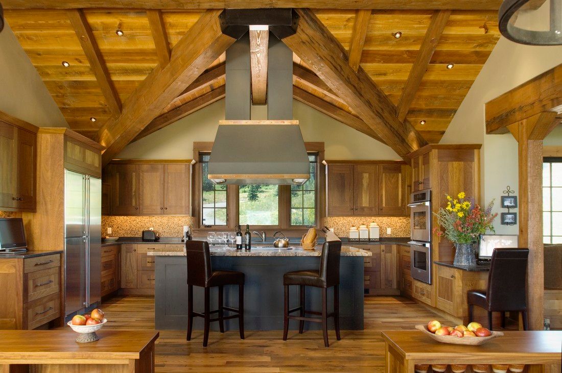A kitchen with a large island in the middle of it