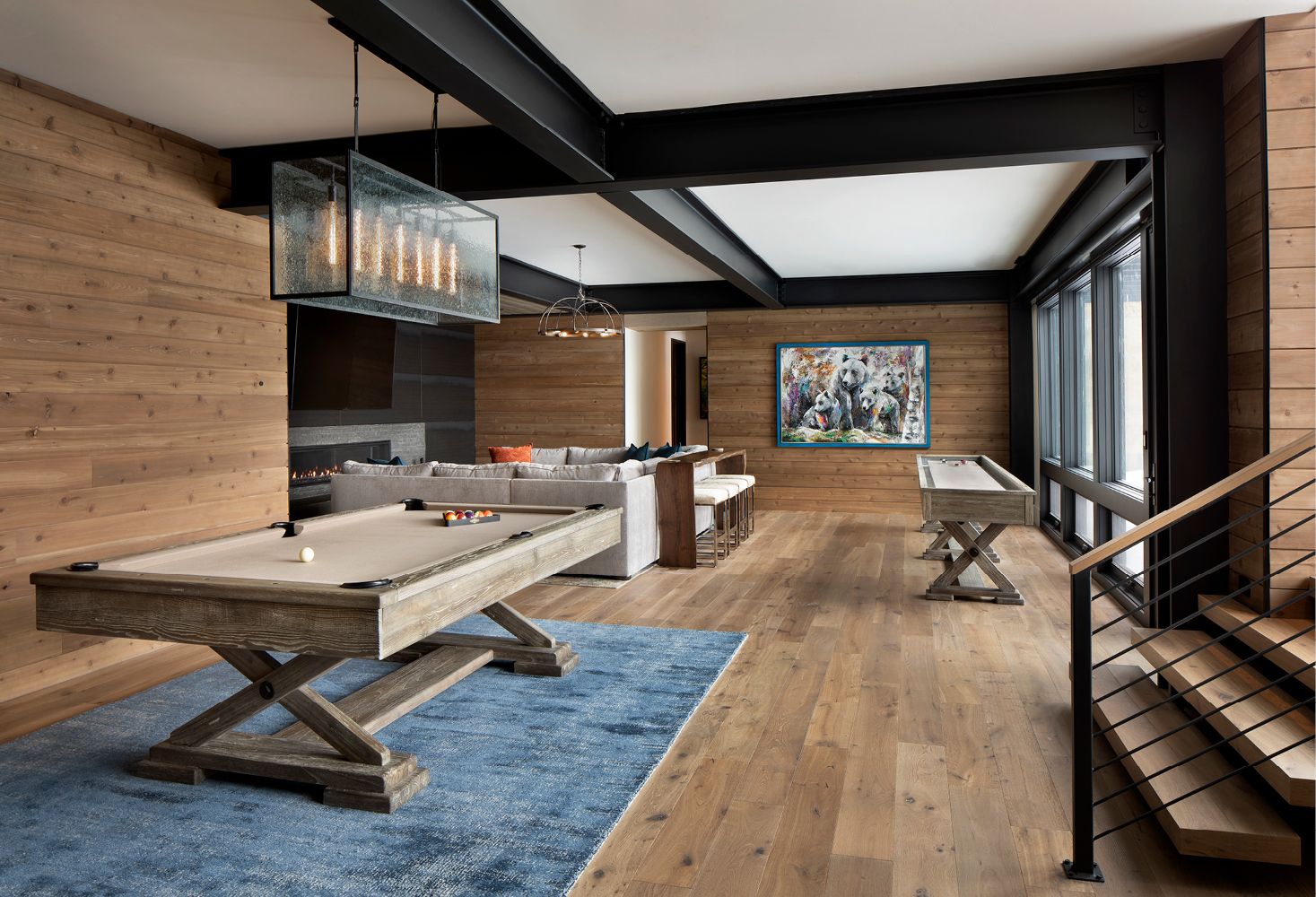 There is a pool table in the middle of the room.