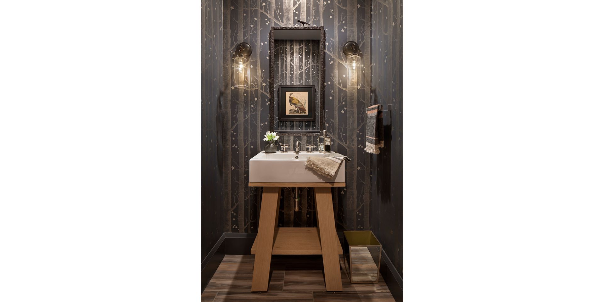 A bathroom with a sink and a mirror on the wall.