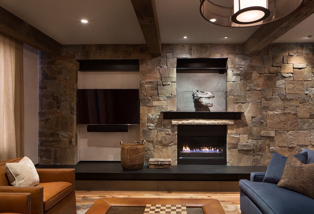 A living room with a fireplace and a flat screen tv