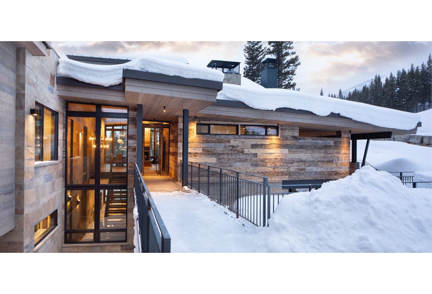 A house with a lot of snow on the roof