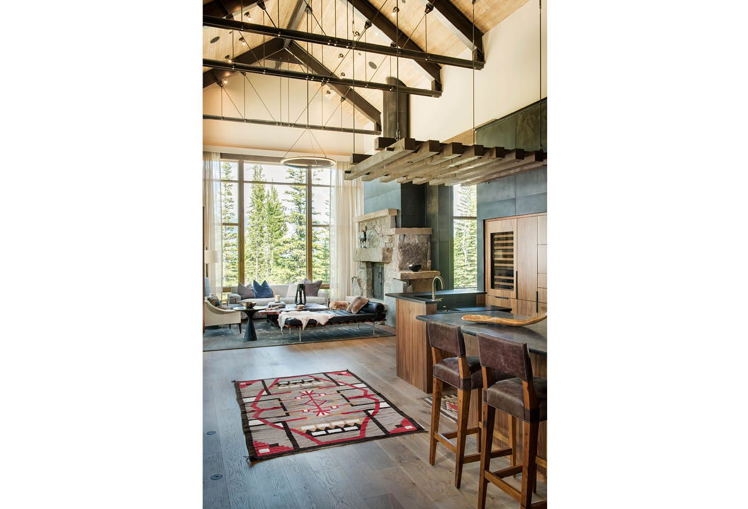 There is a rug on the floor in the middle of the room.