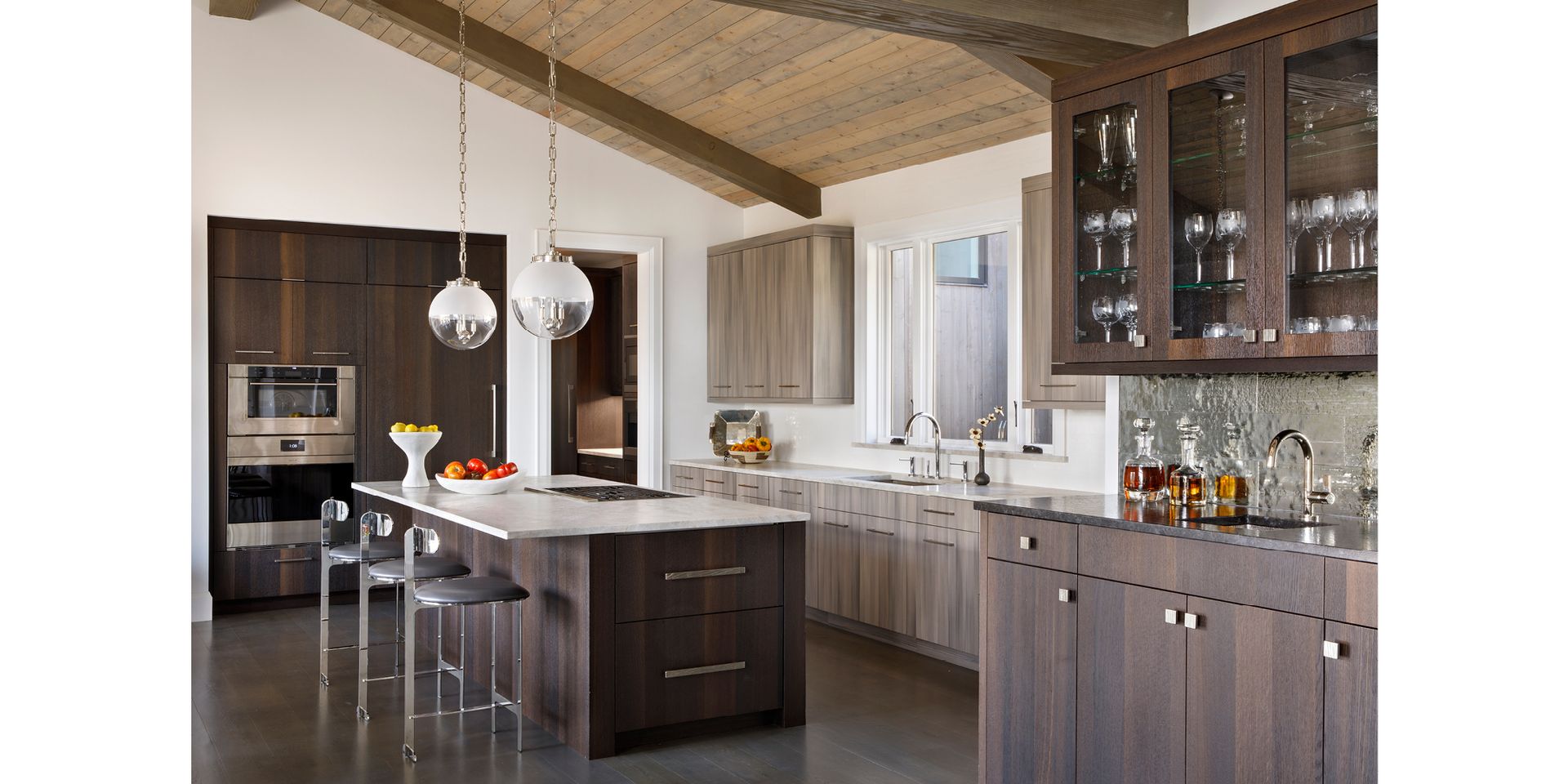 A kitchen with a large island and lots of cabinets