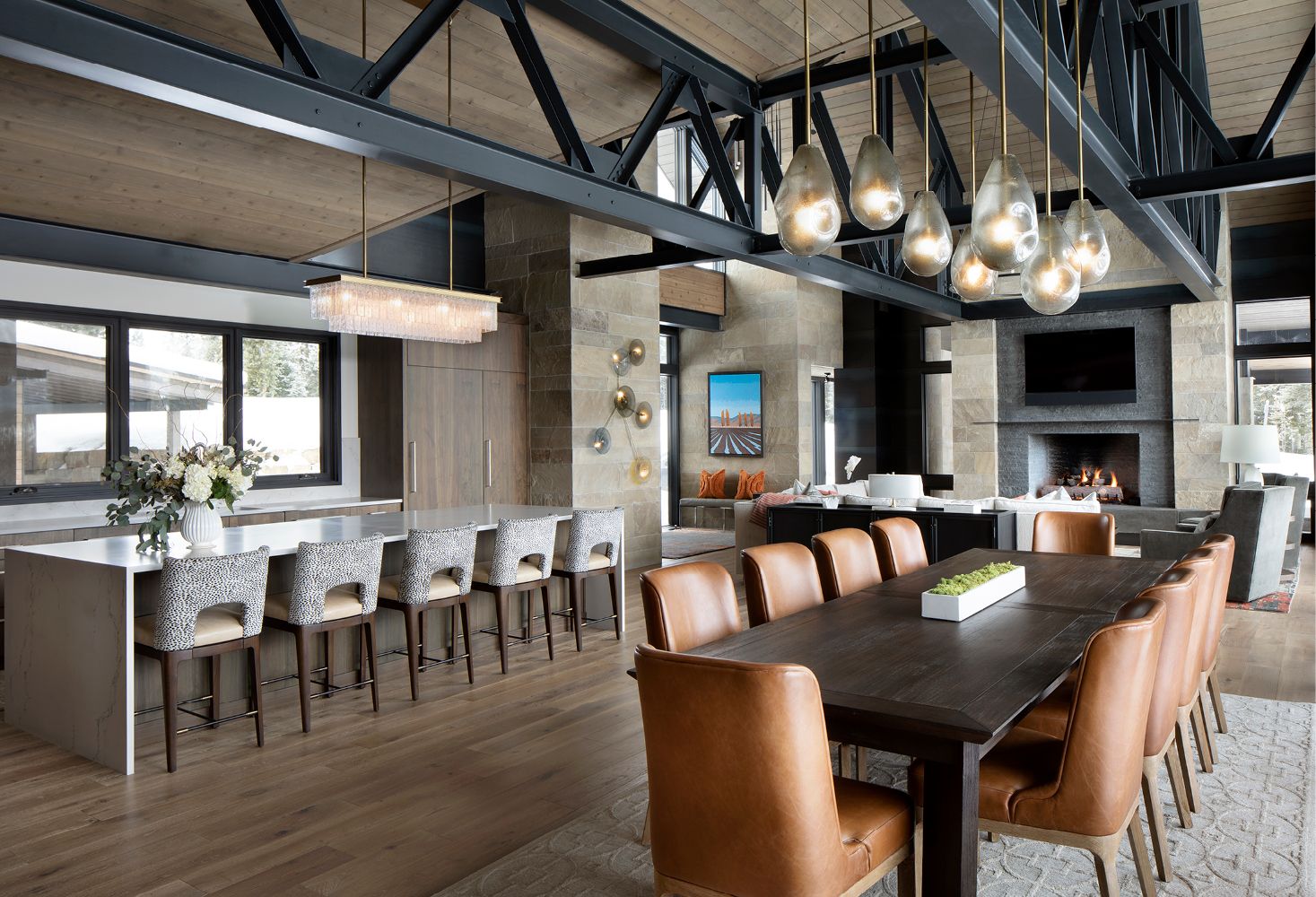 A large dining room with a long table and chairs.
