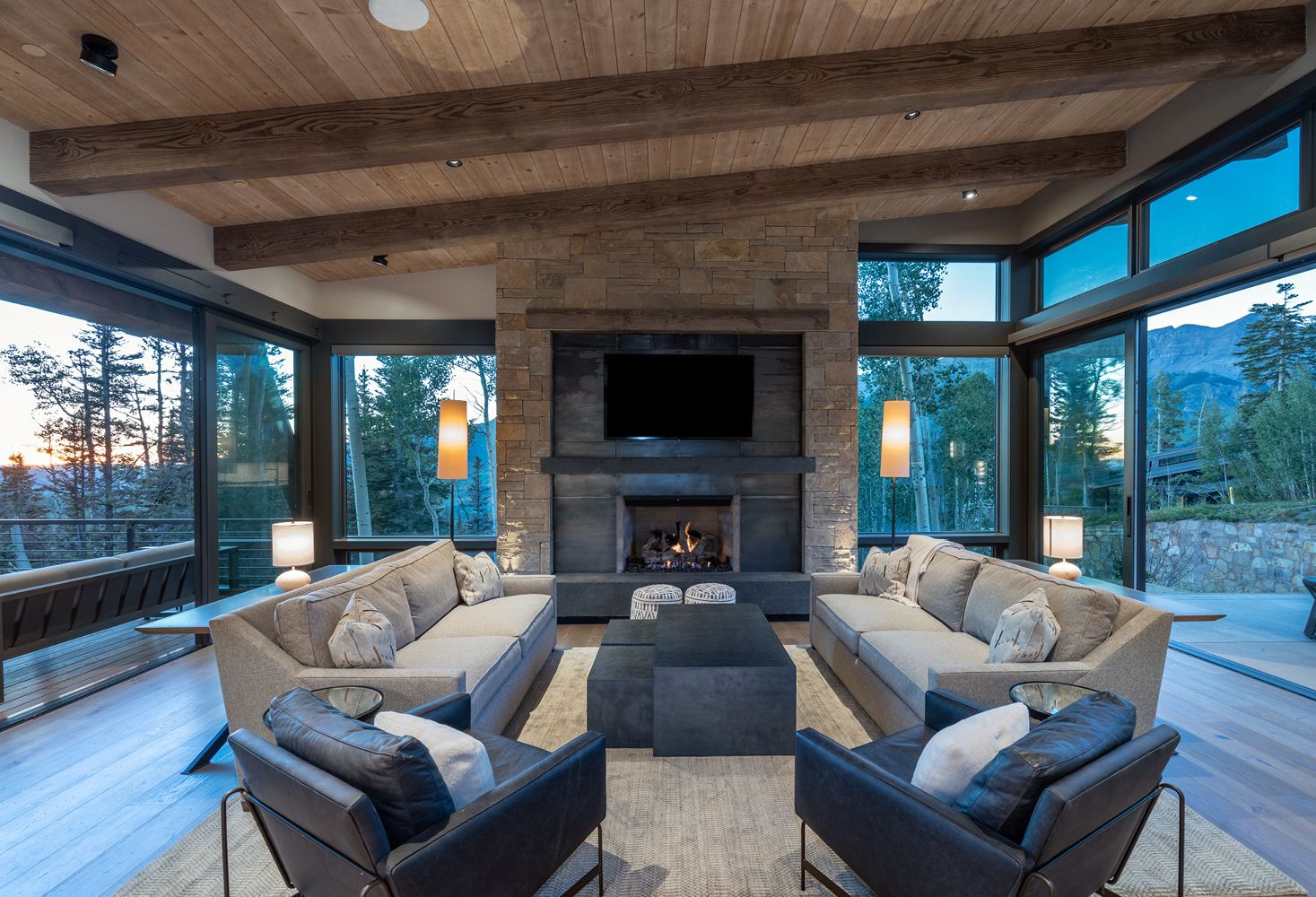A living room filled with furniture and a fireplace.