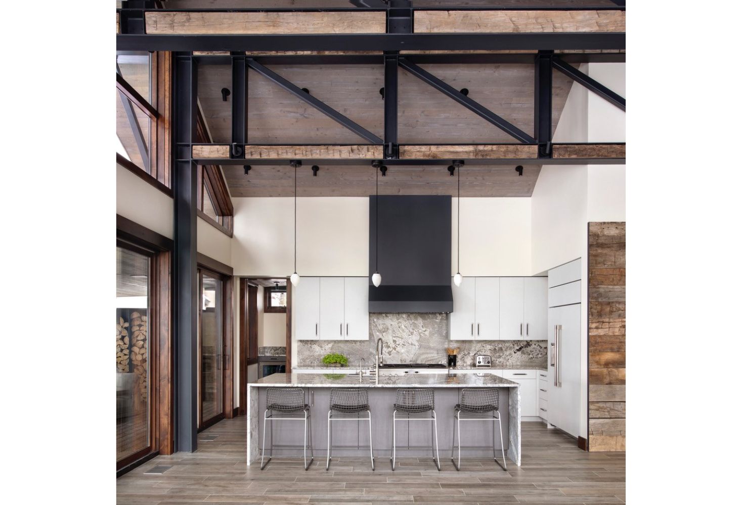 A kitchen with a large island in the middle of the room.